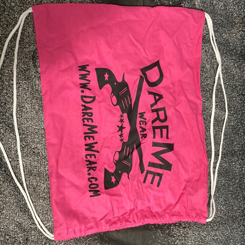 Hot pink “dare me” bag